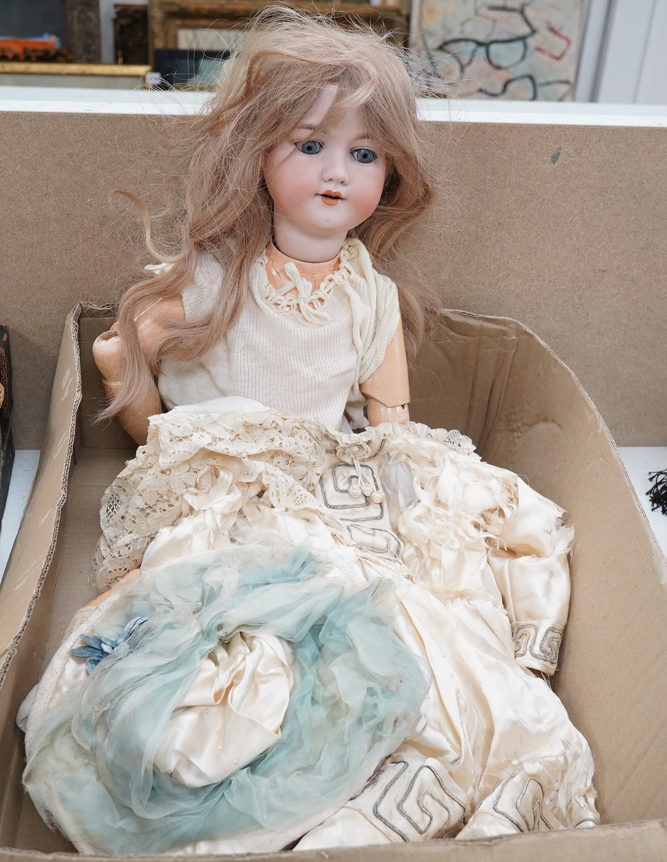 A large Armand Marseille doll with a silk dress, 66cm. Condition - fair to good, silk dress rotted.